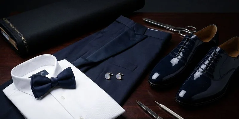 Complete tuxedo ensemble with accessories including bow tie, pocket square, and cufflinks