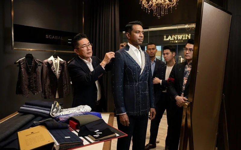 Baste fitting jacket showing temporary stitching and fit assessment marks