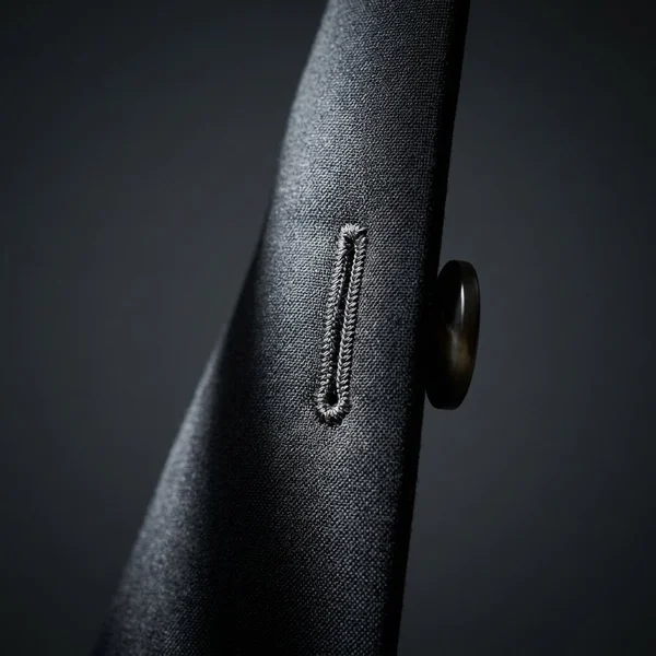 Hand-finished buttonhole detail